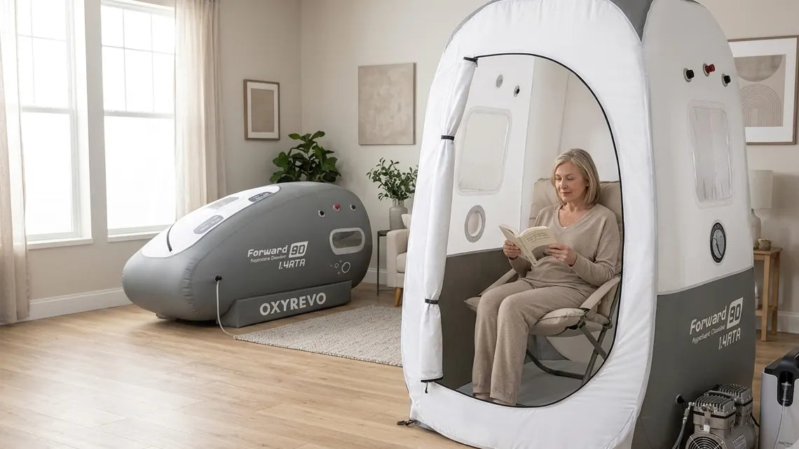Sitting hyperbaric chamber next to a lying soft chamber in a bright home room